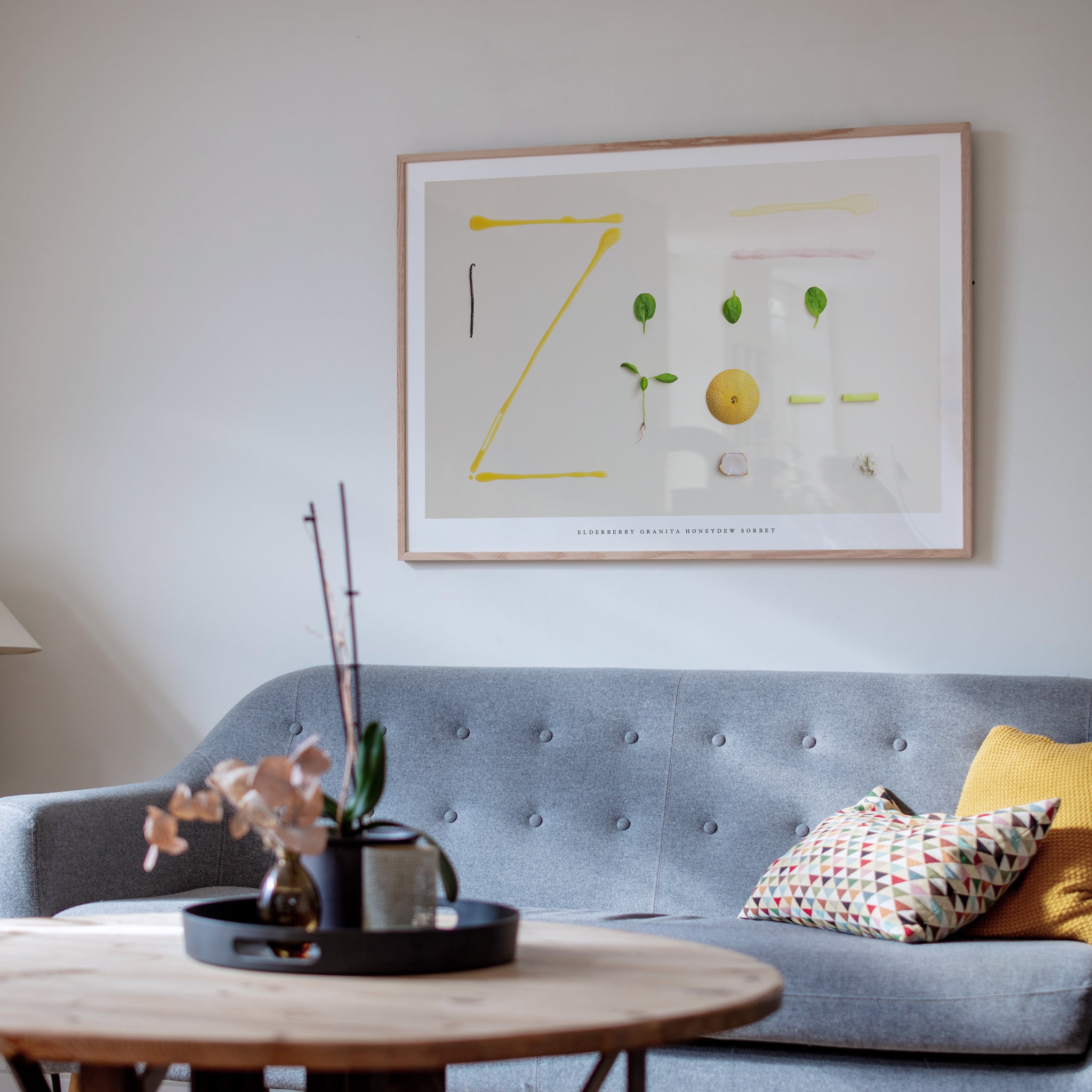 Elderberry Granita Honeydew Sorbet art print in living room with gray sofa