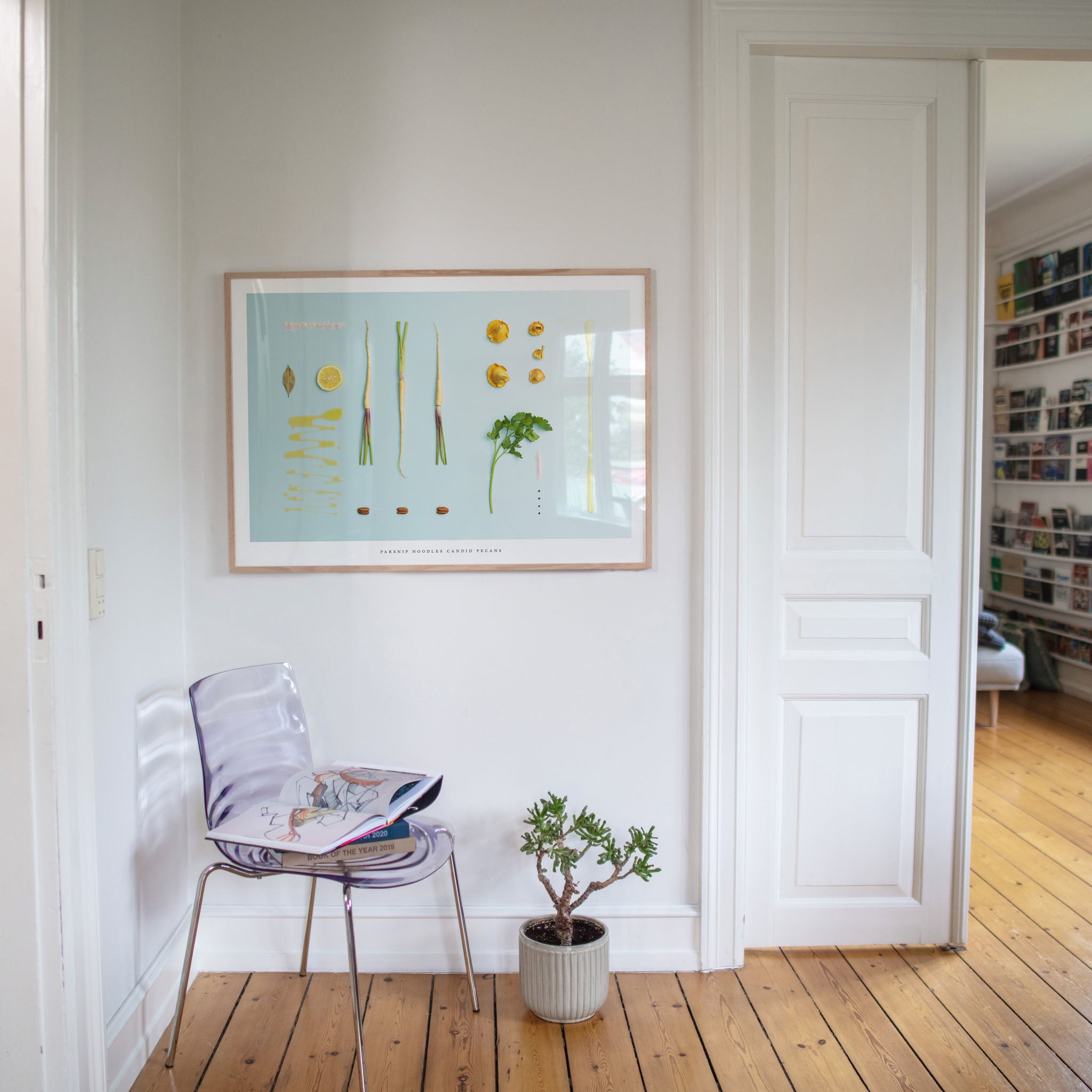 Parsnip Noodles Candid Pecans poster in room with chair and plant