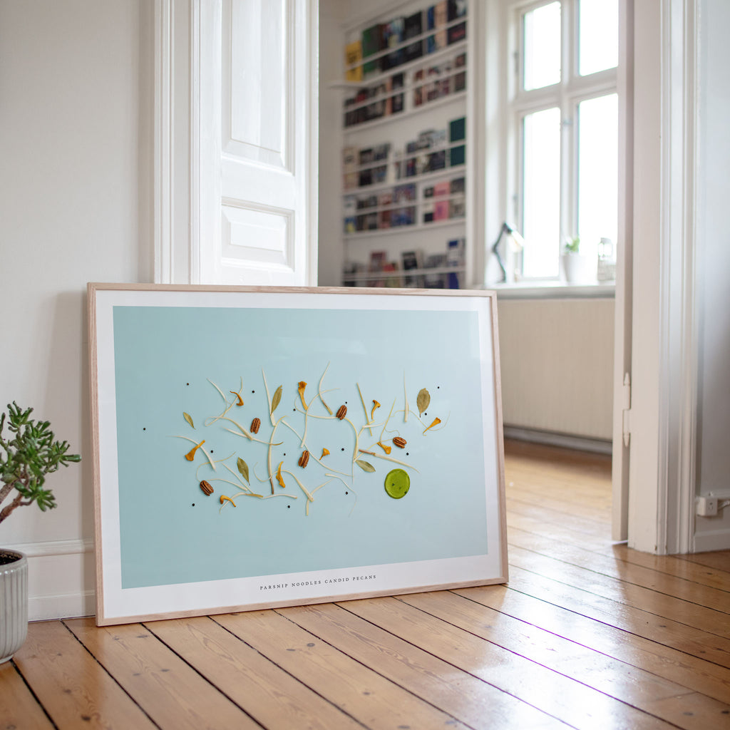 Parsnip Noodles art print on wooden floor in bright room with window