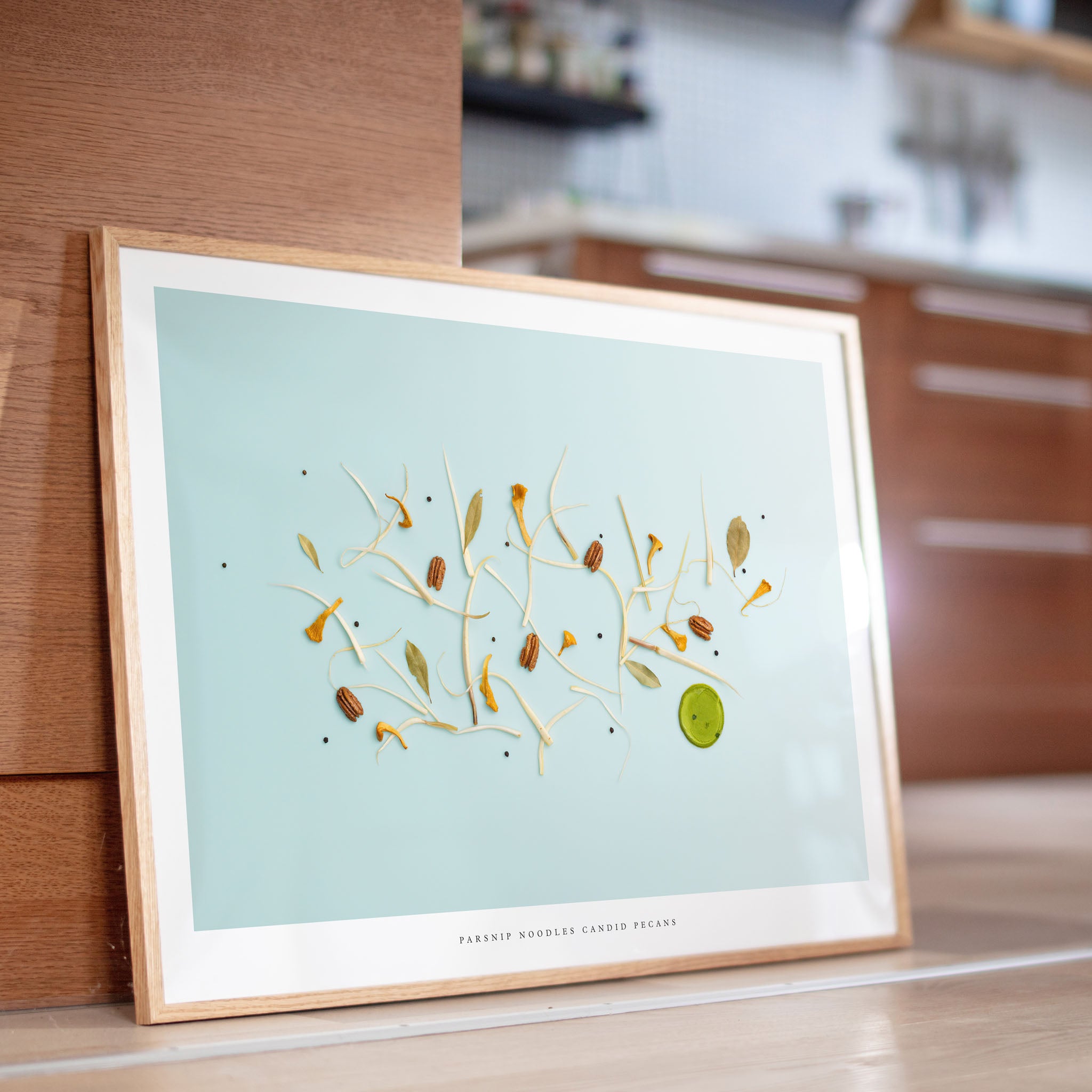 Parsnip Noodles botanical poster displayed on kitchen counter