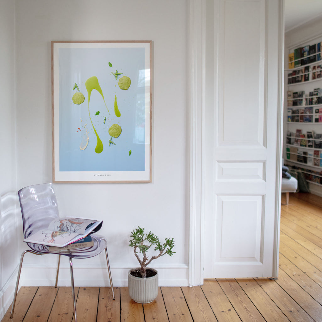 Spinach Dosa art print in room interior   on a white wall.
