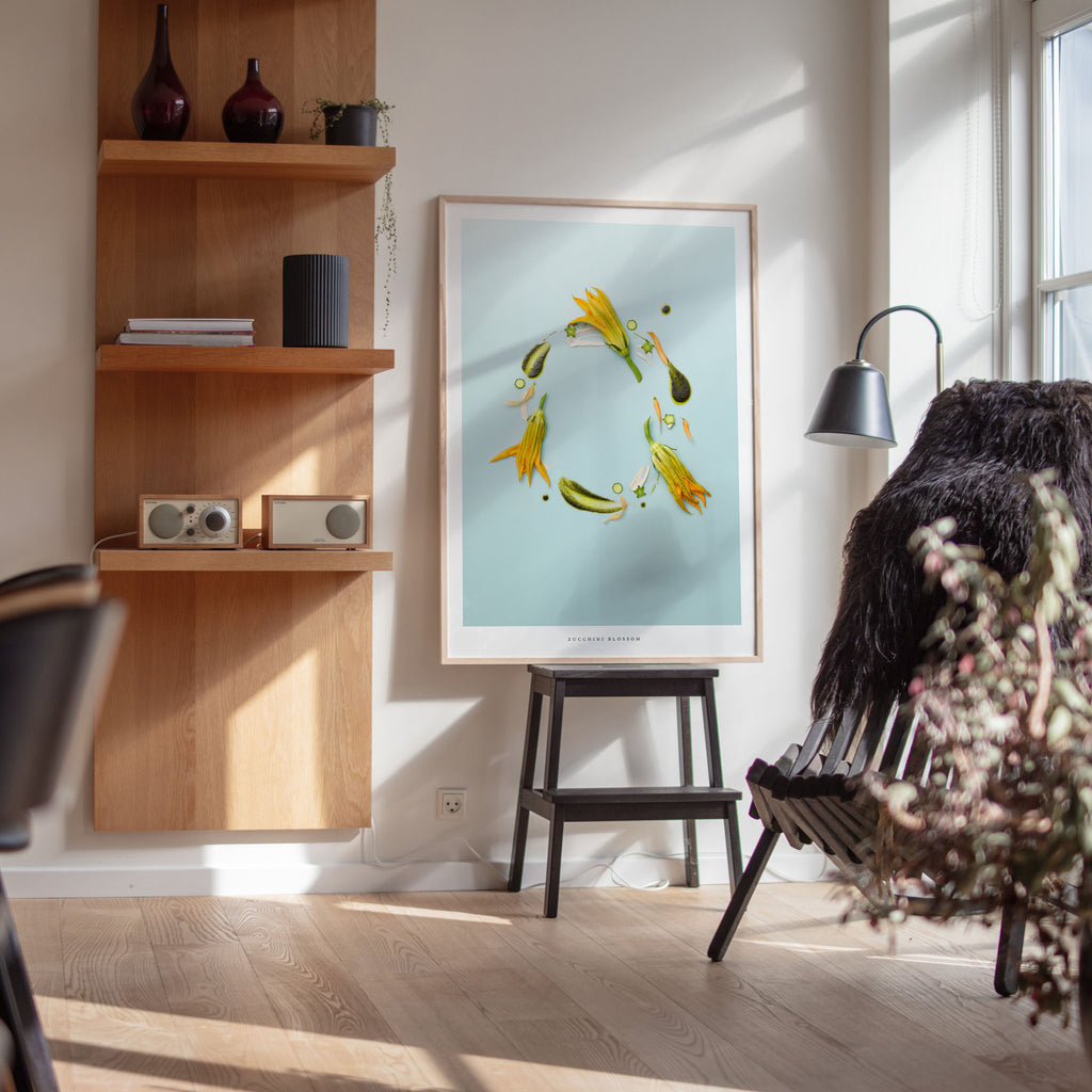 Zucchini Blossom poster in modern interior with wooden shelves and chair.