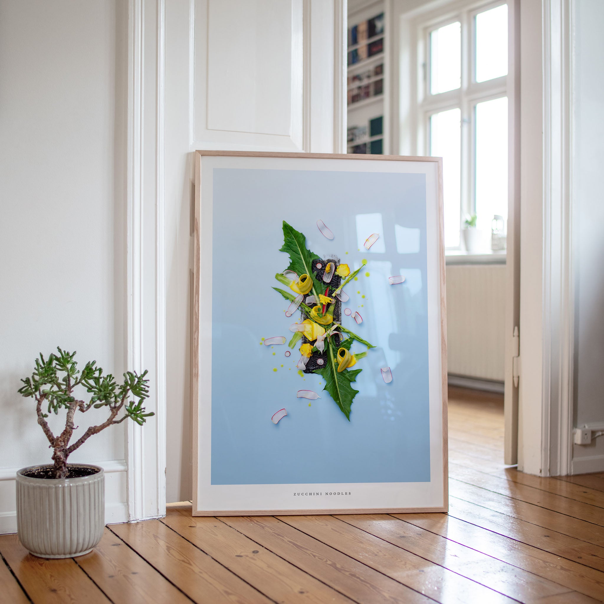 Zucchini Noodles botanical art print on wooden floor with plant