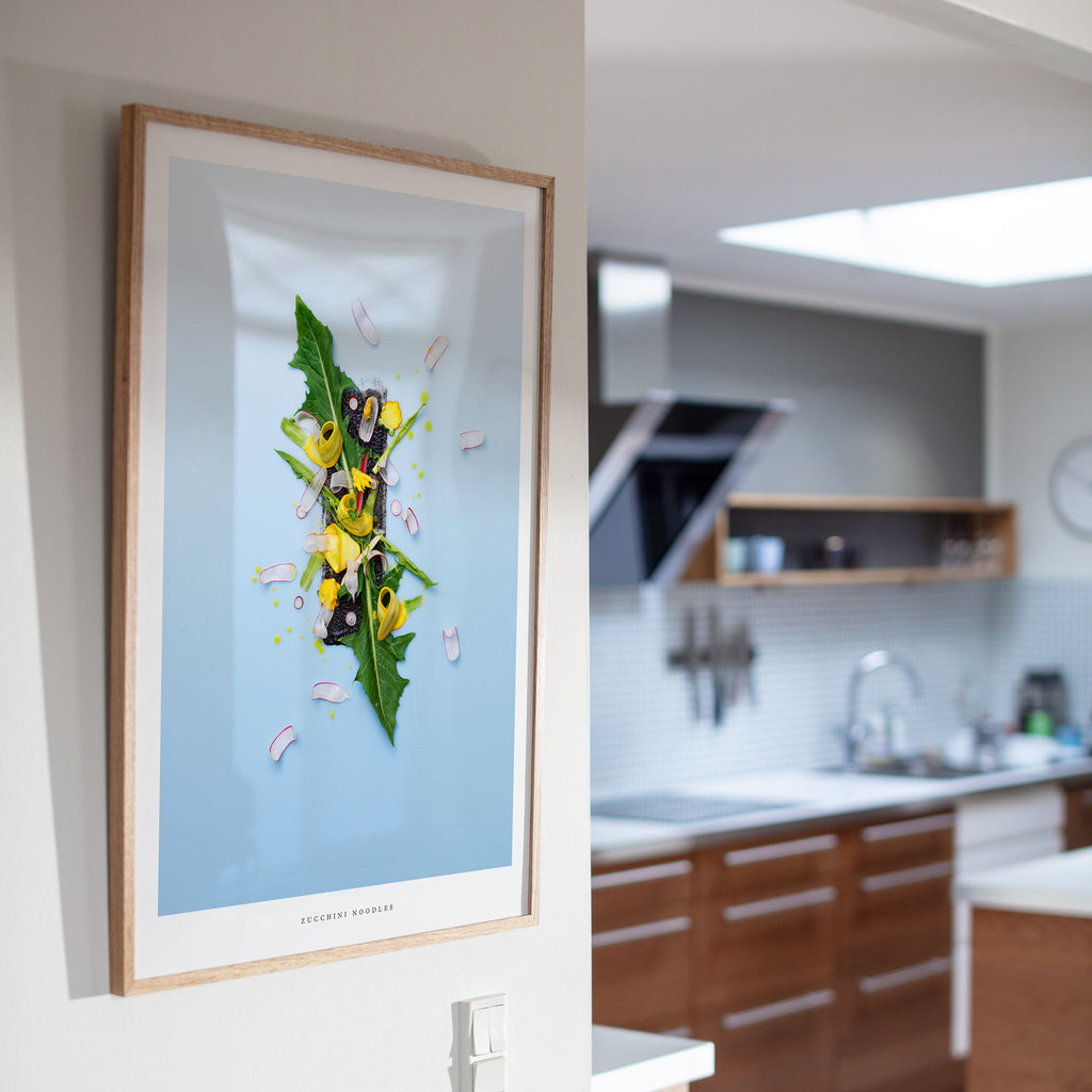 Zucchini Noodles poster – artwork of a vegetable  arrangement on a wall in a kitchen.