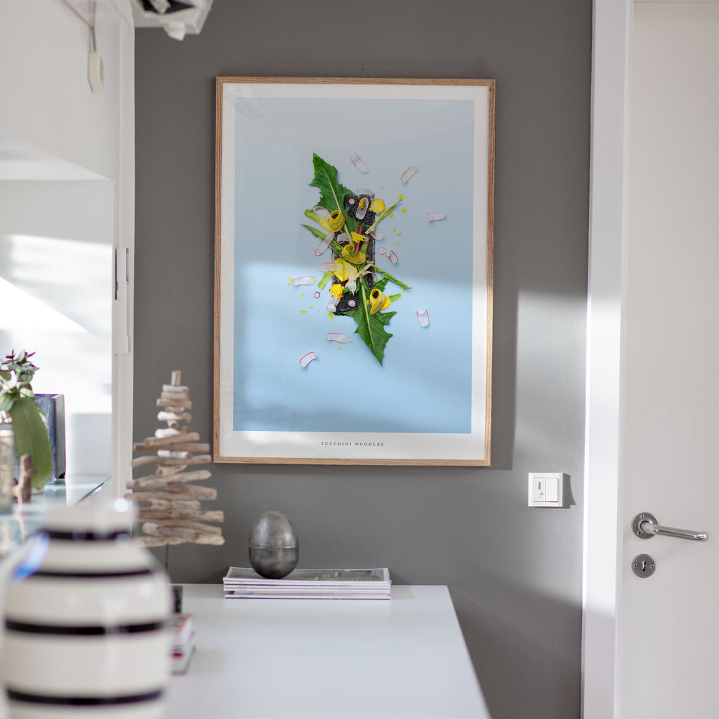 Zucchini Noodles poster on gray wall with decorative items