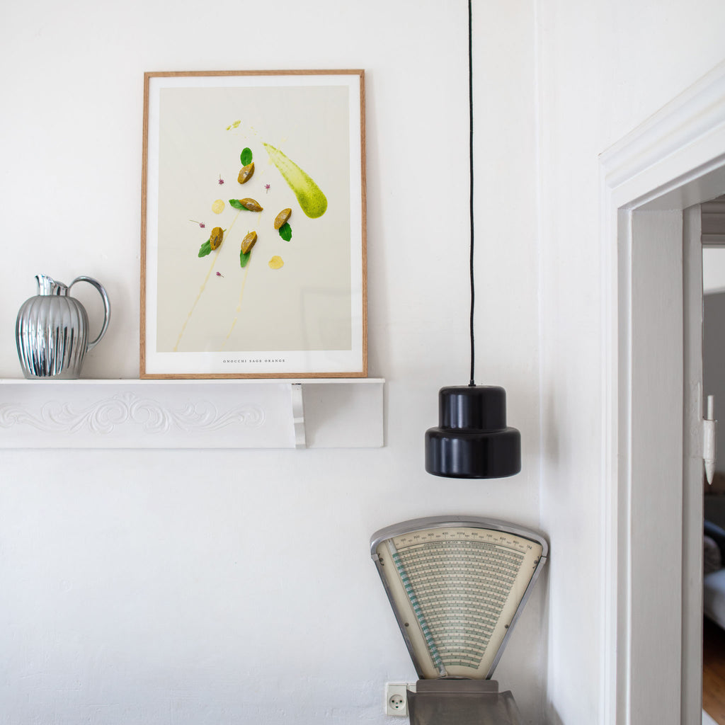 Gnocchi Orange Sage poster in room with lamp and shelf