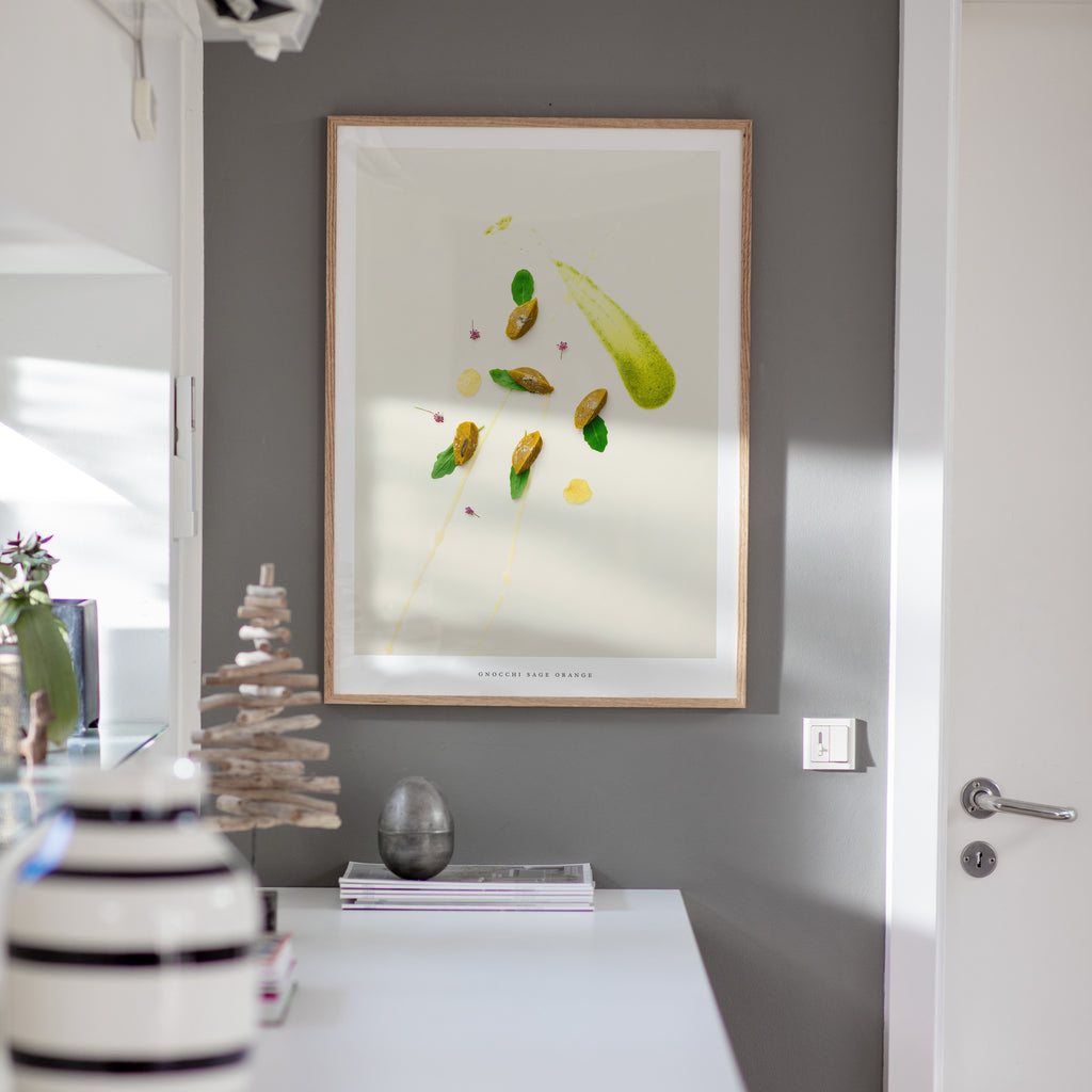 Gnocchi Orange Sage art print on gray wall with decorative items
