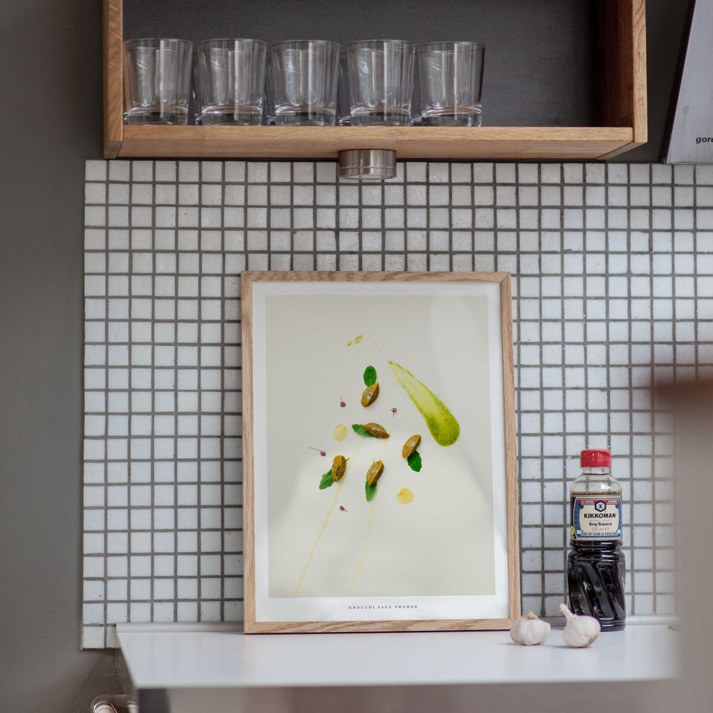 Gnocchi Orange Sage poster on kitchen counter with tiled wall