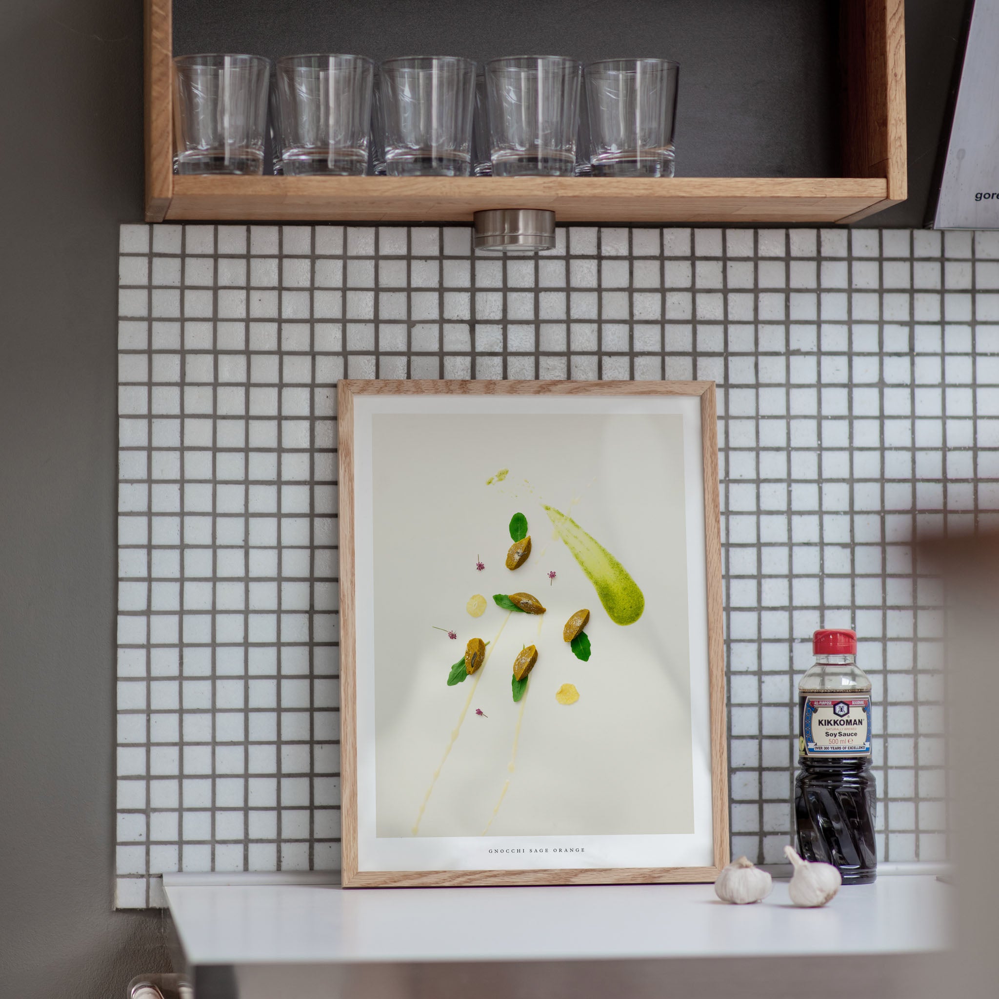 Gnocchi Orange Sage poster on kitchen counter with tiled wall